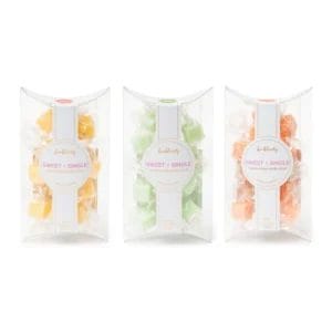 A line up of 3 Bonblissity Mini-Me Pack: Sugar Cube Hand Scrubs in orange- Mango Sorbet, green- Fresh Lemongrass, and pink- Sweet Satsuma.