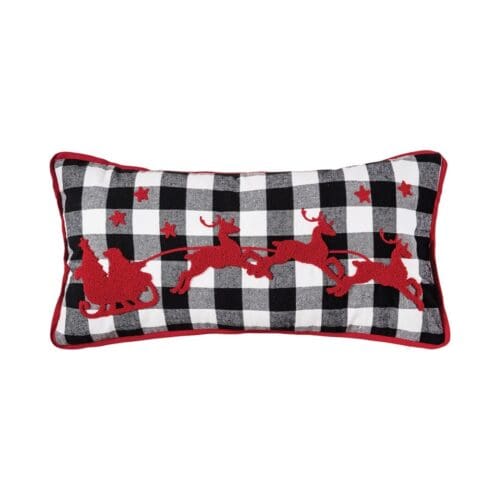 Franklin Farm Sleigh Pillow- a 12x24" cotton pillow with tufted yarn detail that creates Santa's sleigh flying through stars, pulled by three reindeer.