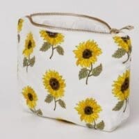 White makeup bag with sunflowers.