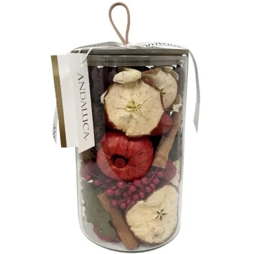 Dried apple potpourri in glass jar.