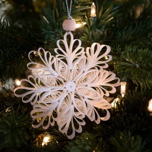 Paper snowflake Christmas tree ornament.