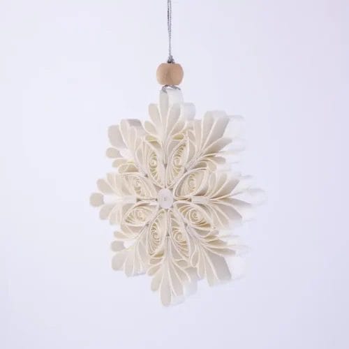 Off-white paper snowflake ornament.