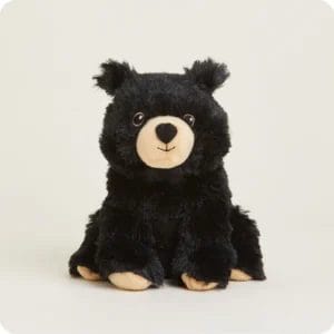 Adorable black plush bear sitting.