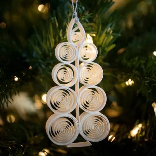 White paper quilled Christmas tree ornament.