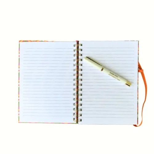 Open notebook with pen on page.