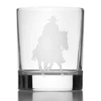 Etched cowboy riding horse on glass.