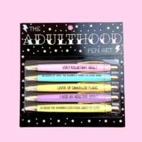 Here's an alt tag for the image: Funny pastel adulting pen set.