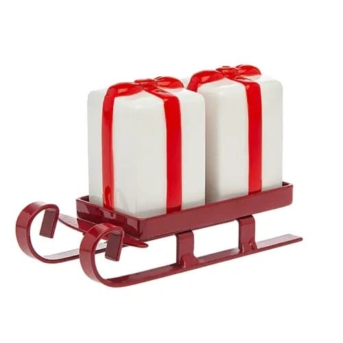 Christmas gift salt and pepper shakers on sleigh.