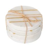 White marble coasters with gold detail.